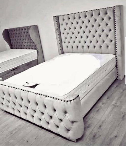 Aries curved wing back bed in plush velvet